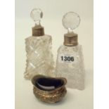 Two cut glass scent bottles with silver collars - sold with a silver salt with blue glass liner