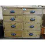 A 27½" old pine wall hanging chest with two flights of four short drawers