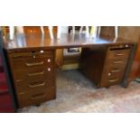 A 5' mid 20th Century stained mixed wood twin pedestal desk by Abbess (A204), with flanking