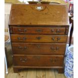 A 28½" 19th Century mahogany bureau with fitted interior and four long graduated drawers under,