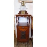 A 15½" Edwardian walnut coal purdonium with carved raised back, shelf and turned supports, carved
