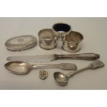 Three silver napkin rings, a jar top and teaspoon, small silver locket, plated mustard spoon and