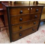 A 3' 8" late Georgian mahogany chest of two short and three long graduated drawers with flanking