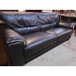 A 6' 10" modern brown leather upholstered three seater settee