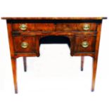 A 34½" antique mahogany, cross banded and strung kneehole desk with long frieze drawer and
