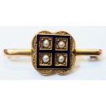 A late Victorian 9ct. gold bar brooch, set with four seed pearls within a blue enamelled and lobed