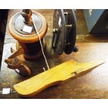 A treen string box, an antique wood fishing reel, folding boot jack with concealed contents and a