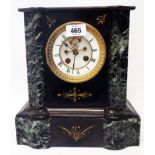 A late Victorian black slate and green marble cased mantel clock with visible anchor escapement