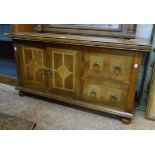 A 3' 9 1/2" "Malabar" low cabinet with two short drawers and two cupboard doors, set on bun feet