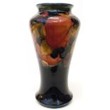 A 9" mid 20th Century Moorcroft vase with pomegranate decoration signed and marked - small firing