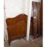 A French walnut bedroom suite, comprising gentleman's and lady's wardrobes enclosed by mirror