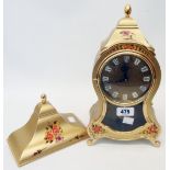 A reproduction ornate gilt and floral decorated bracket timepiece with battery movement