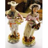 A pair of 19th Century Staffordshire figures of fruit sellers