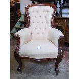 A Victorian mahogany part-show frame spoon back drawing room armchair upholstered in beige Damask,