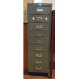 An 11" Bisley grey painted metal nine drawer filing cabinet with key