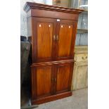 A 34" reproduction inlaid yew wood drinks cabinet with moulded cornice and two pairs of panelled