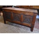 A 3' 7" carved oak linen chest in the style of a 17th Century triple panelled coffer