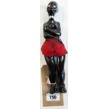 A French ebony nutcracker bottle opener combination in the form of an African lady, marked A.