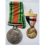 A Second World War Defence medal - sold with a 1937 George VI Coronation medal