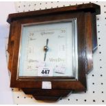 An Art Deco style polished oak cased aneroid barometer with square dial
