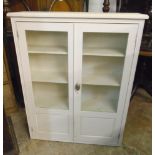 A 33" early 20th Century painted wood cabinet with four shelves enclosed by a pair of part glazed