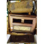 A box containing various wood items including an oak folding book stand, two boxes, tennis press,