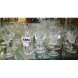 A collection of cut and moulded glassware including champagne cups, cordials, etc.