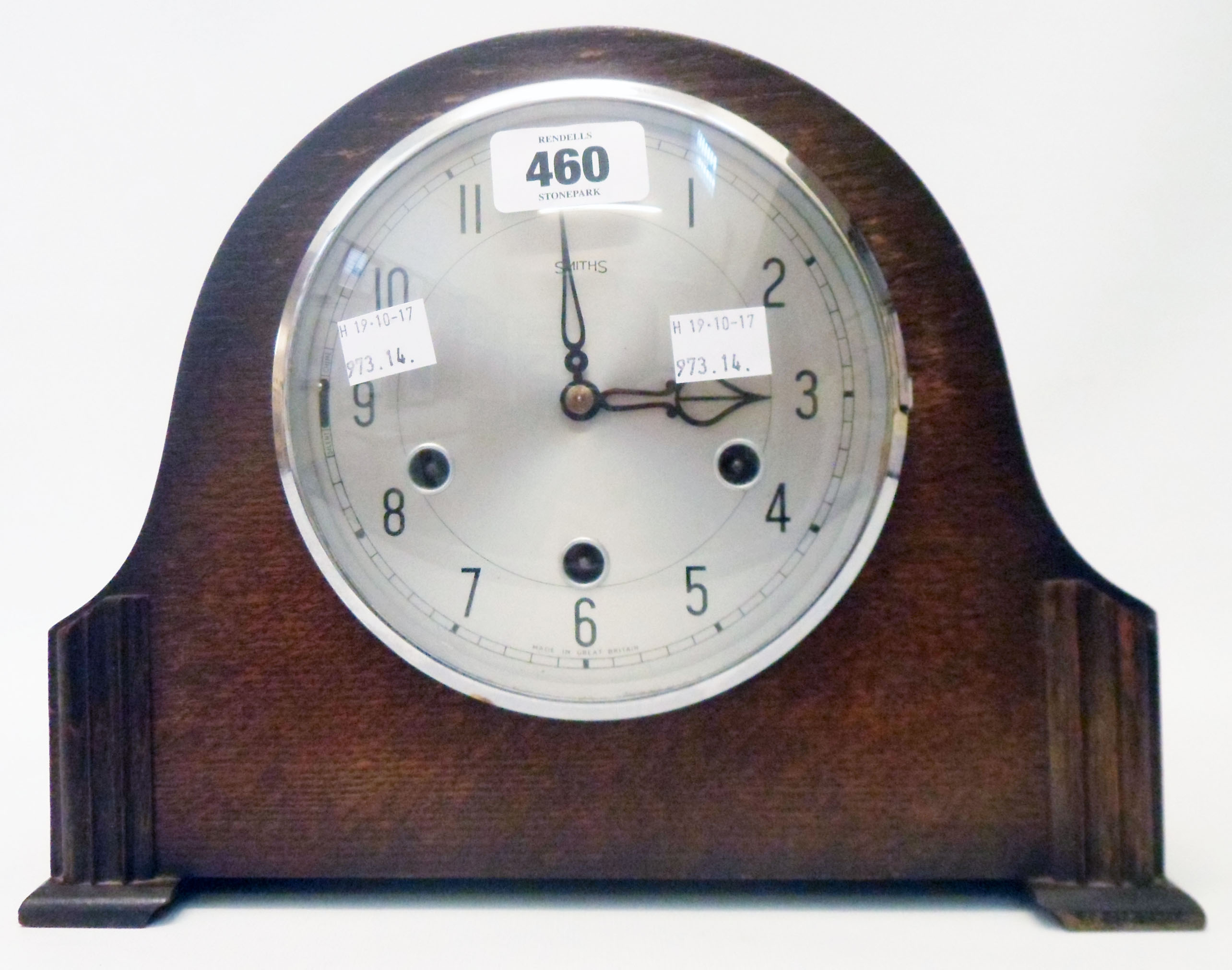 A mid 20th Century polished oak cased mantel clock with Smiths eight day Westminster chiming
