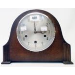 A mid 20th Century polished oak cased mantel clock with Smiths eight day Westminster chiming