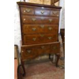 A 3' 5" antique walnut herringbone strung and cross banded chest on stand with moulded top, canted