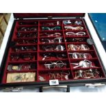 An optician's case containing a collection of 20th Century spectacles, lorgnettes, monocles and