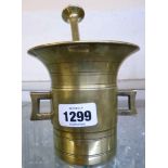A 19th Century brass pestle and mortar with square handles