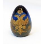 A 1 1/2" Russian blue glass egg with etched gilt Imperial eagle motif