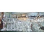 A collection of glass drinking vessels including wines, tumblers, brandy bowls, etc.