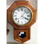 An American stained wood cased drop-dial wall clock with printed paper dial marked for JNo.