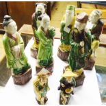 Six of eight 8 1/2" Chinese pottery Immortals - sold with two similar smaller figures - various