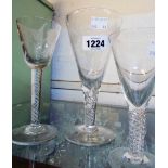 A collection of glassware including wines with twist stems and etched grape and vine leaf