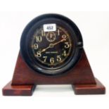 A 7 3/4" diameter mid 20th Century bakelite cased bulkhead clock with black dial, Arabic numerals