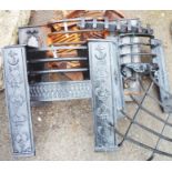 Three Victorian cast iron fire fronts, one with flanking anchor motifs - sold with three grates,