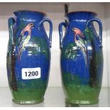 A pair of Torquay pottery parrot pattern tyg vases