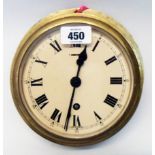 A 7" diameter brass cased bulkhead clock with bayonet fitting bezel and eight day timepiece