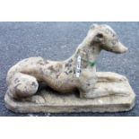 A 27" concrete garden statue of a recumbent greyhound