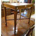 A polished oak occasional table, set on moulded square tapered legs with spade feet and X-stretcher