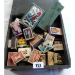 A scientific instrument case containing a collection of vintage matchboxes including Royal Swan