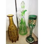 A 15 1/4" green overlay glass claret jug, an amber coloured mallet decanter (no stopper), and a