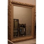 A modern parcel gilt and painted framed bevelled oblong wall mirror - 3' 9" X 33 1/2"
