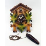 A mid 20th Century tourist cuckoo wall clock with single weight driven movement