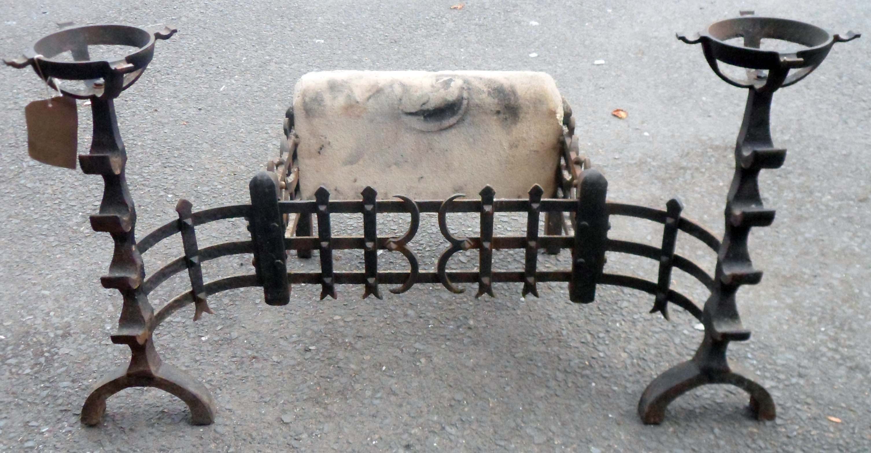 A 34" antique style fire grate with flanking mull holders