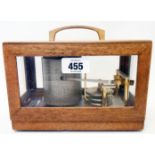 A small polished oak and glazed cased Maxant 93100 Montreuil barograph