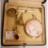 A 9ct. gold framed circular cameo panel brooch - sold with a smoky quartz pendant, another on chain,